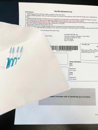 DNA submission form and envelope containing 4 uncapped interdental gum brushes